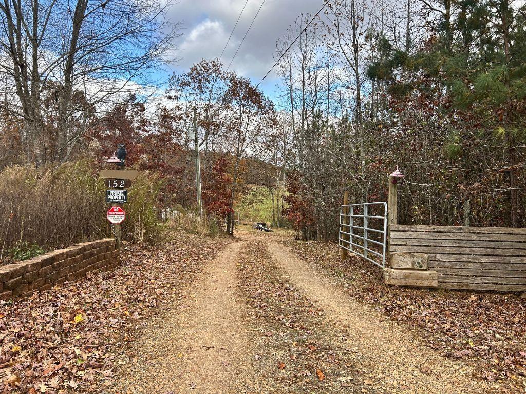 152 Rocket Drive Cleveland, GA 30528 - Photo 10 of 12 a backyard of a house with lots of green space