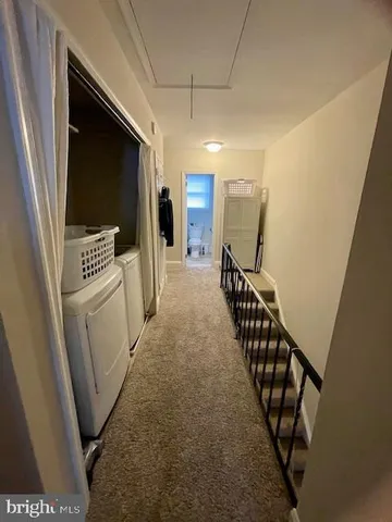 a view of a hallway with stairs