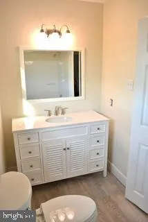 a bathroom with a sink double vanity and a mirror