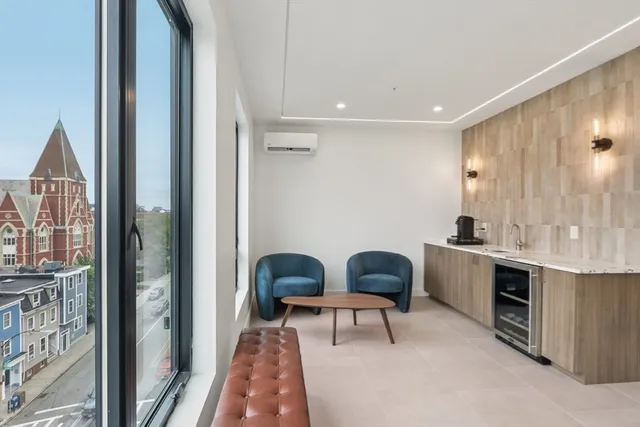 a view of kitchen with sink dining table and chairs