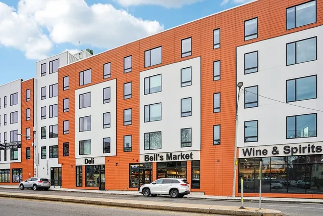 a front view of a building with lot of windows