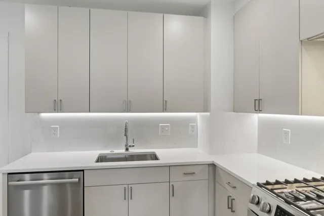 a bathroom with a sink and a washing machine