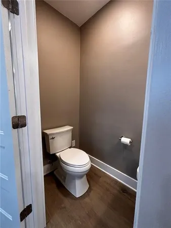 a kitchen with stainless steel appliances granite countertop a sink a stove a refrigerator and cabinets