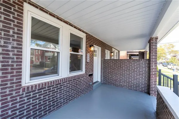 a view of a brick house with windows