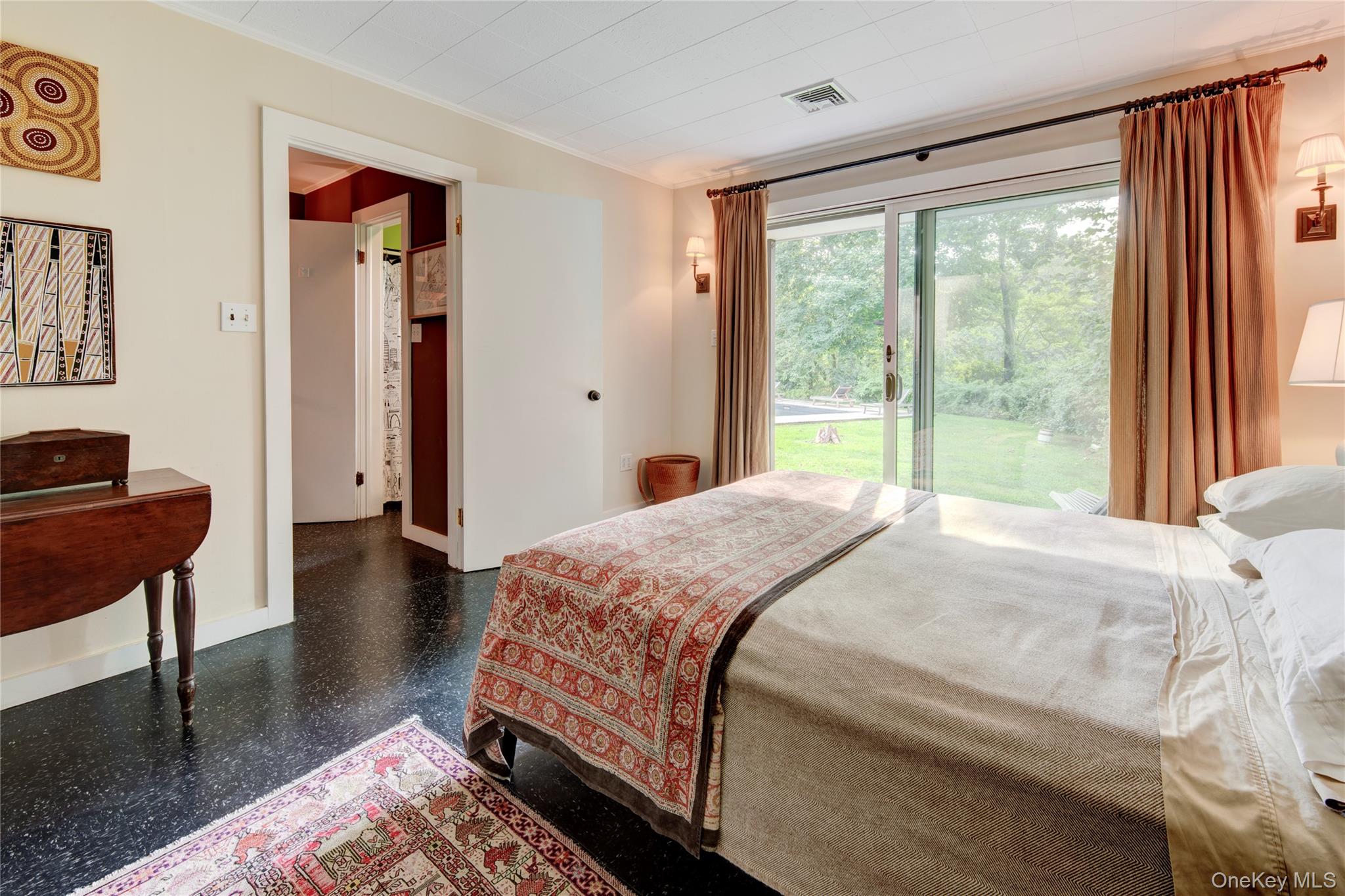 495 Maple Lane Orient, NY 11957 - Photo 12 of 17 a bedroom with a bed and a large window