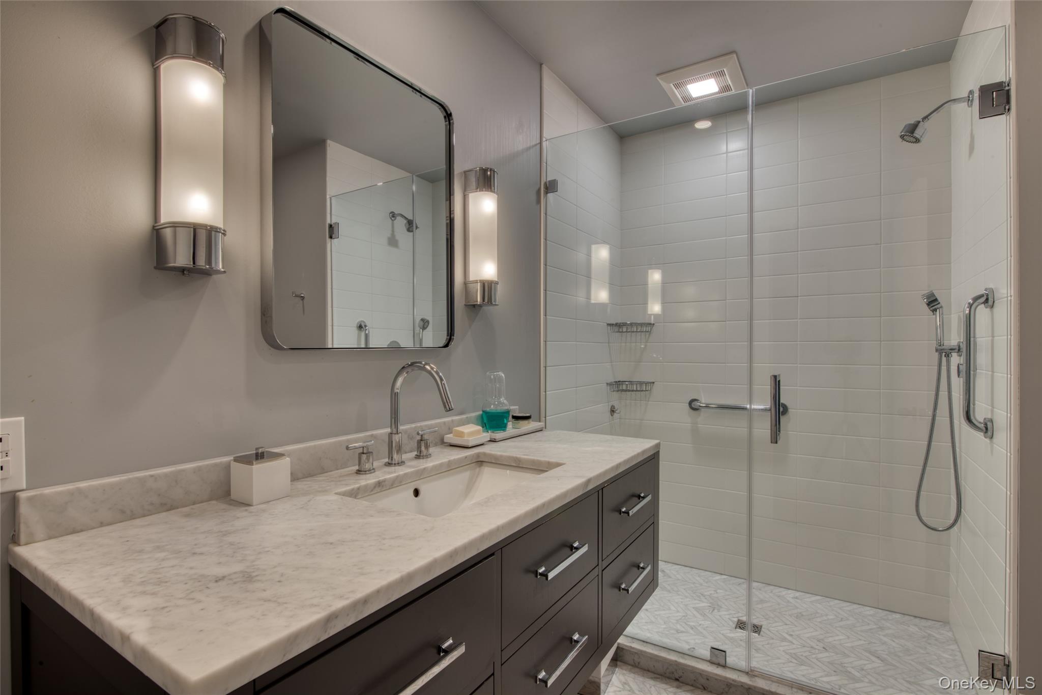 495 Maple Lane Orient, NY 11957 - Photo 13 of 17 a bathroom with a sink shower and a mirror