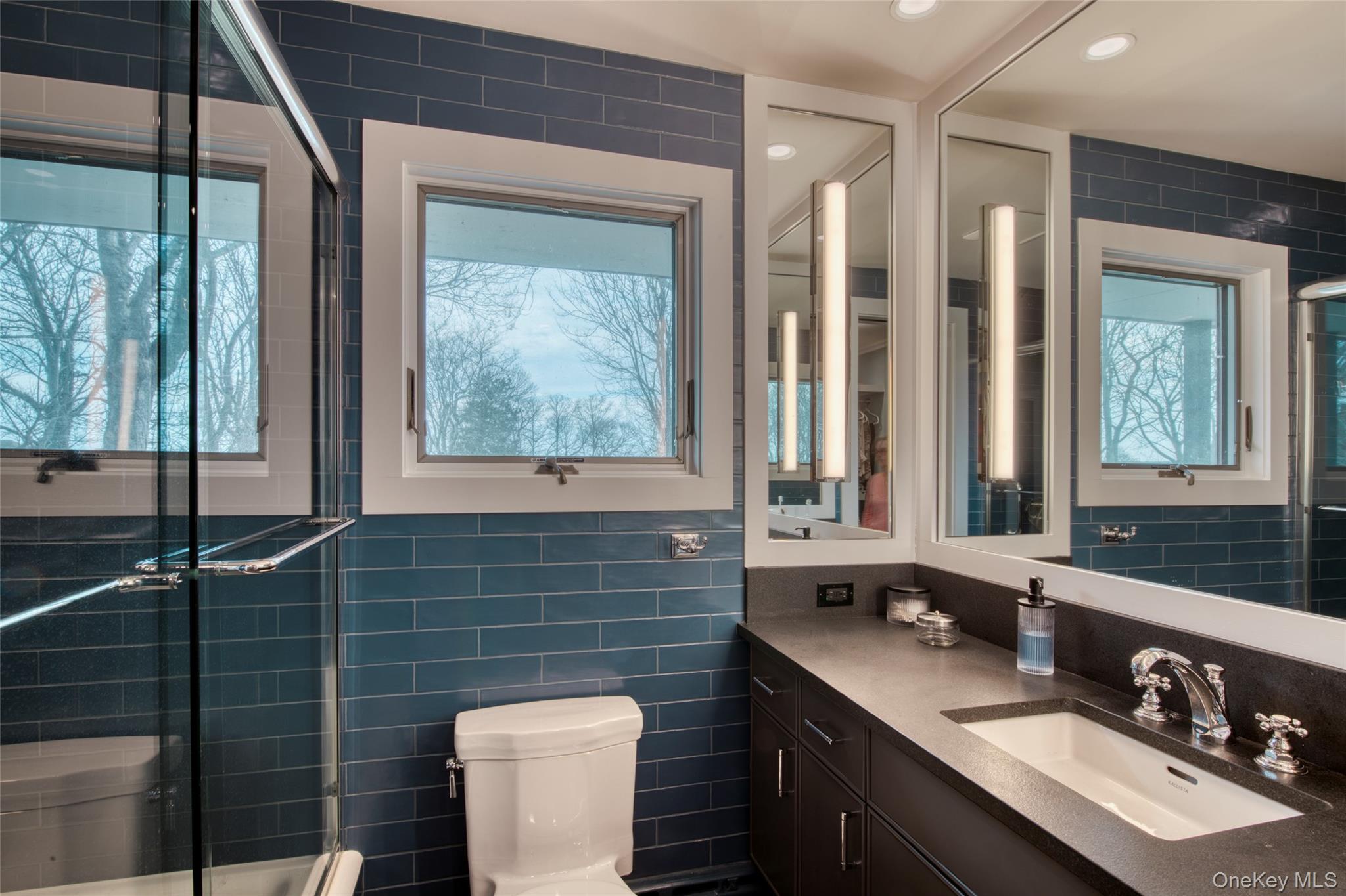 495 Maple Lane Orient, NY 11957 - Photo 16 of 17 a bathroom with a sink and a mirror