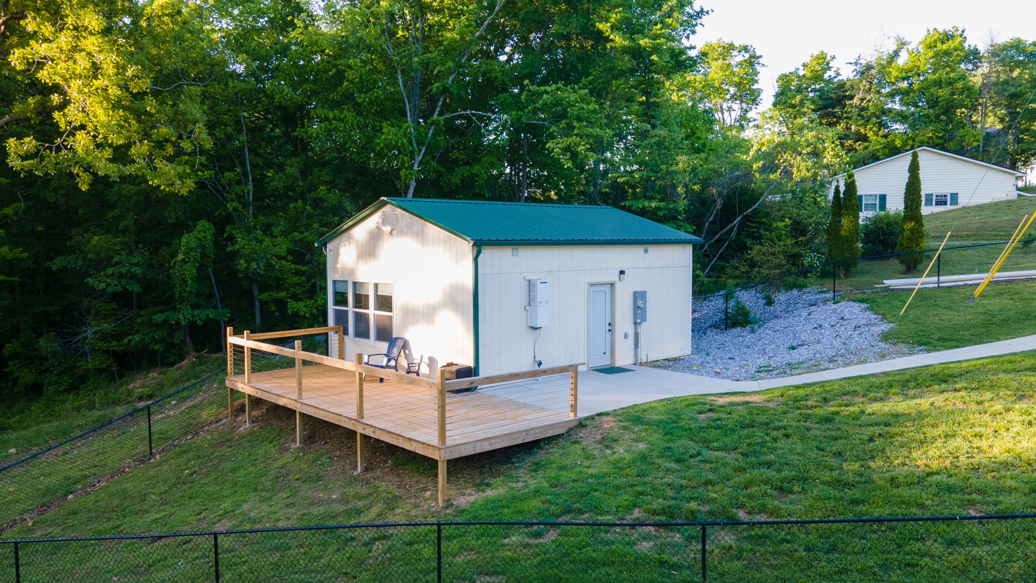 601 Pumpkin Ridge Road Dover, TN 37058 - Photo 6 of 50 a view of a house with a yard and deck area