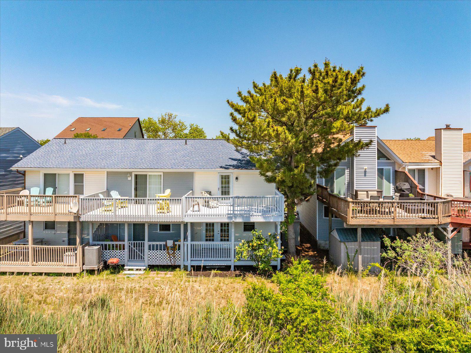 135 Jamestown Road, Unit 18A Ocean City, MD 21842 - Photo 56 of 63 a view of a house with pool and sitting area