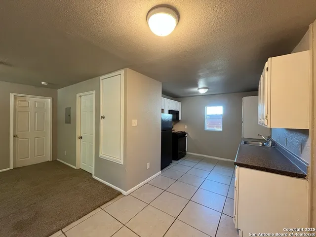 a view of a kitchen with a sink