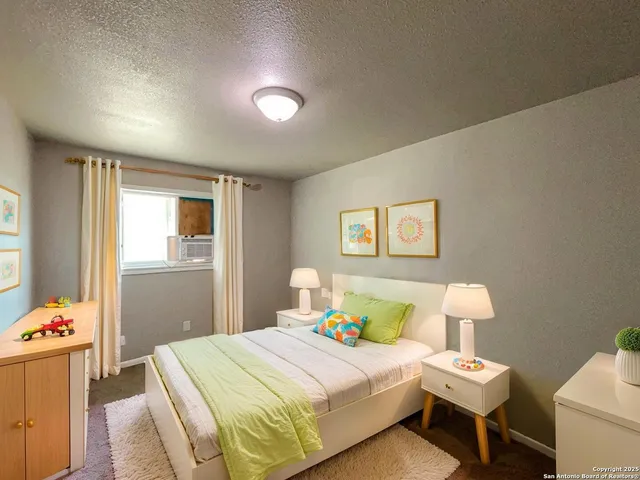 a bedroom with a bed and a table in it