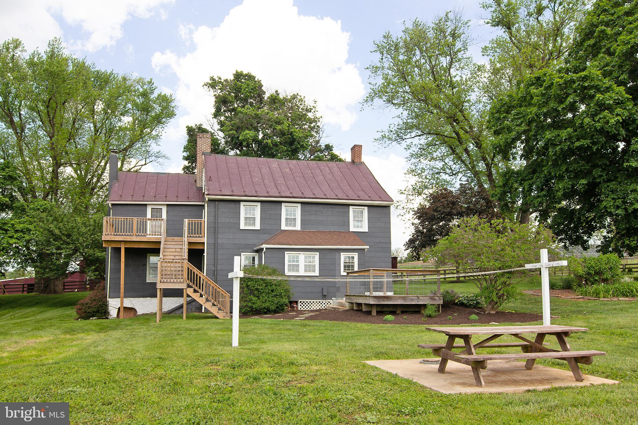 10121 B Clemsonville Road Union Bridge, MD 21791 - Photo 4 of 41 a view of a house with swimming pool and a yard