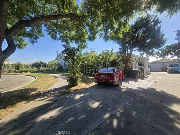 a view of a lake with a car parked on the road