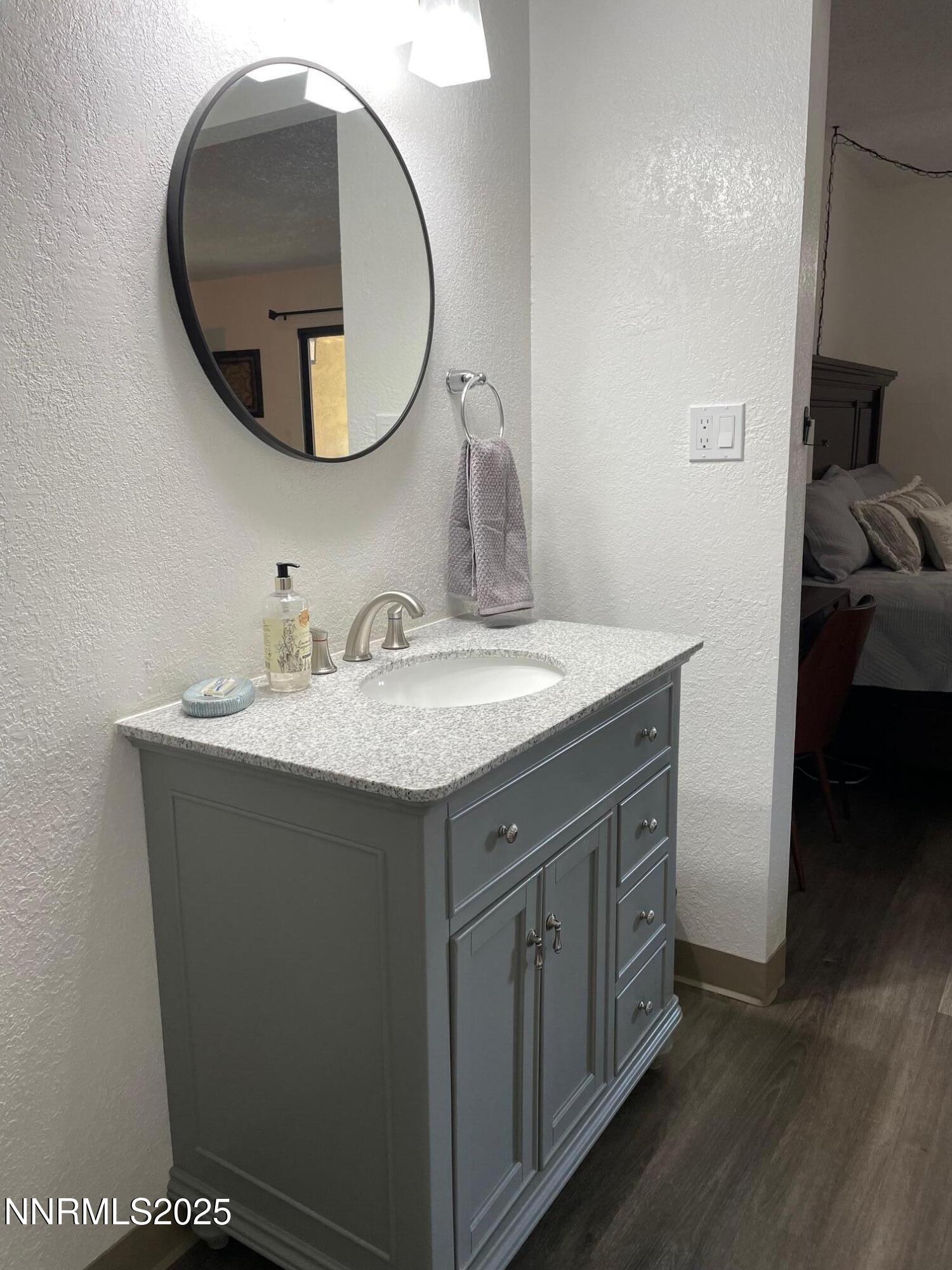 2450 Lymbery Street, Unit 230 Reno, NV 89509 - Photo 12 of 24 a bathroom with a sink and a mirror
