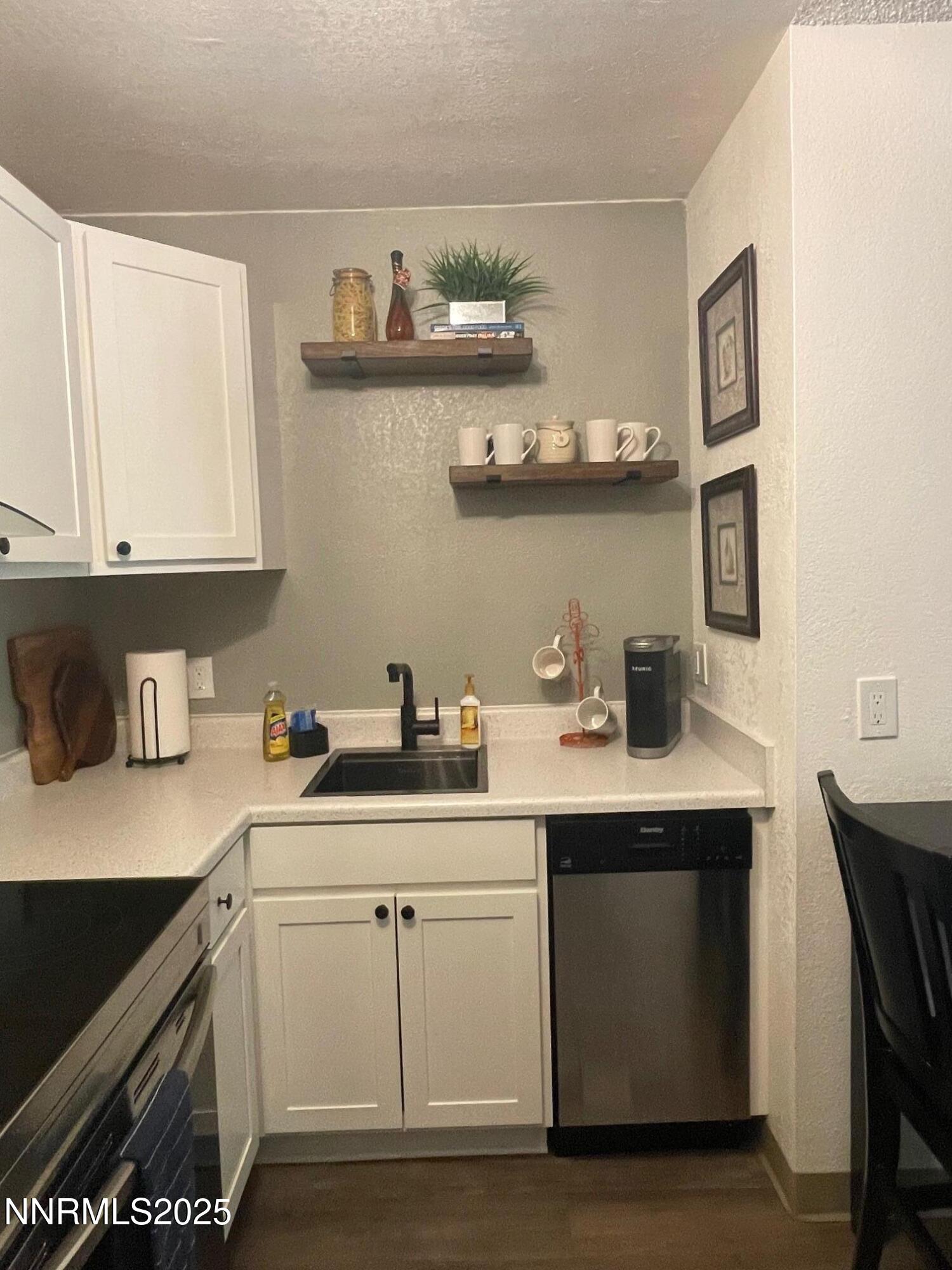 2450 Lymbery Street, Unit 230 Reno, NV 89509 - Photo 3 of 24 a kitchen with stainless steel appliances a sink a stove and cabinets