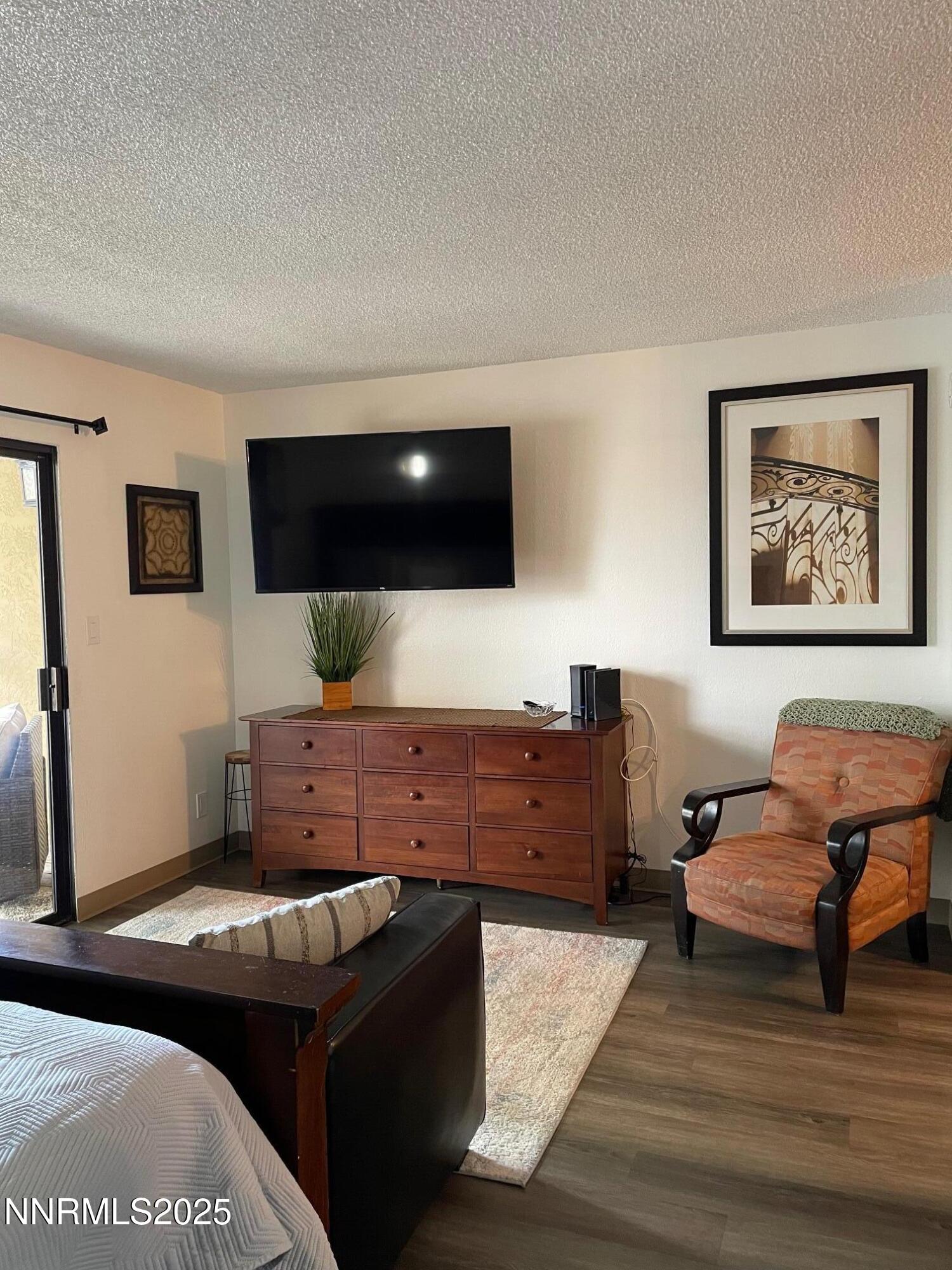2450 Lymbery Street, Unit 230 Reno, NV 89509 - Photo 5 of 24 a living room with furniture and a flat screen tv