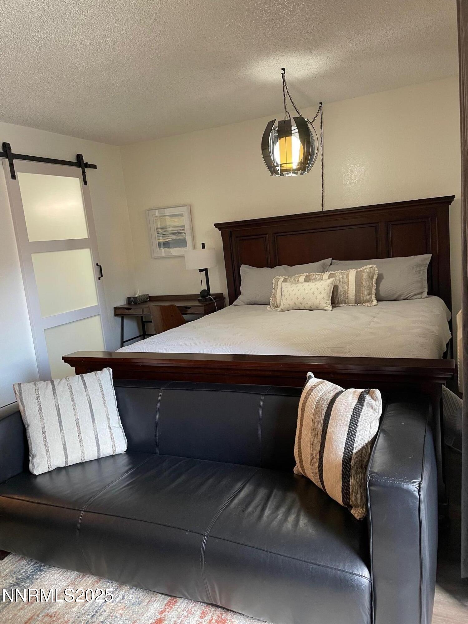 2450 Lymbery Street, Unit 230 Reno, NV 89509 - Photo 6 of 24 a bedroom with a bed and window