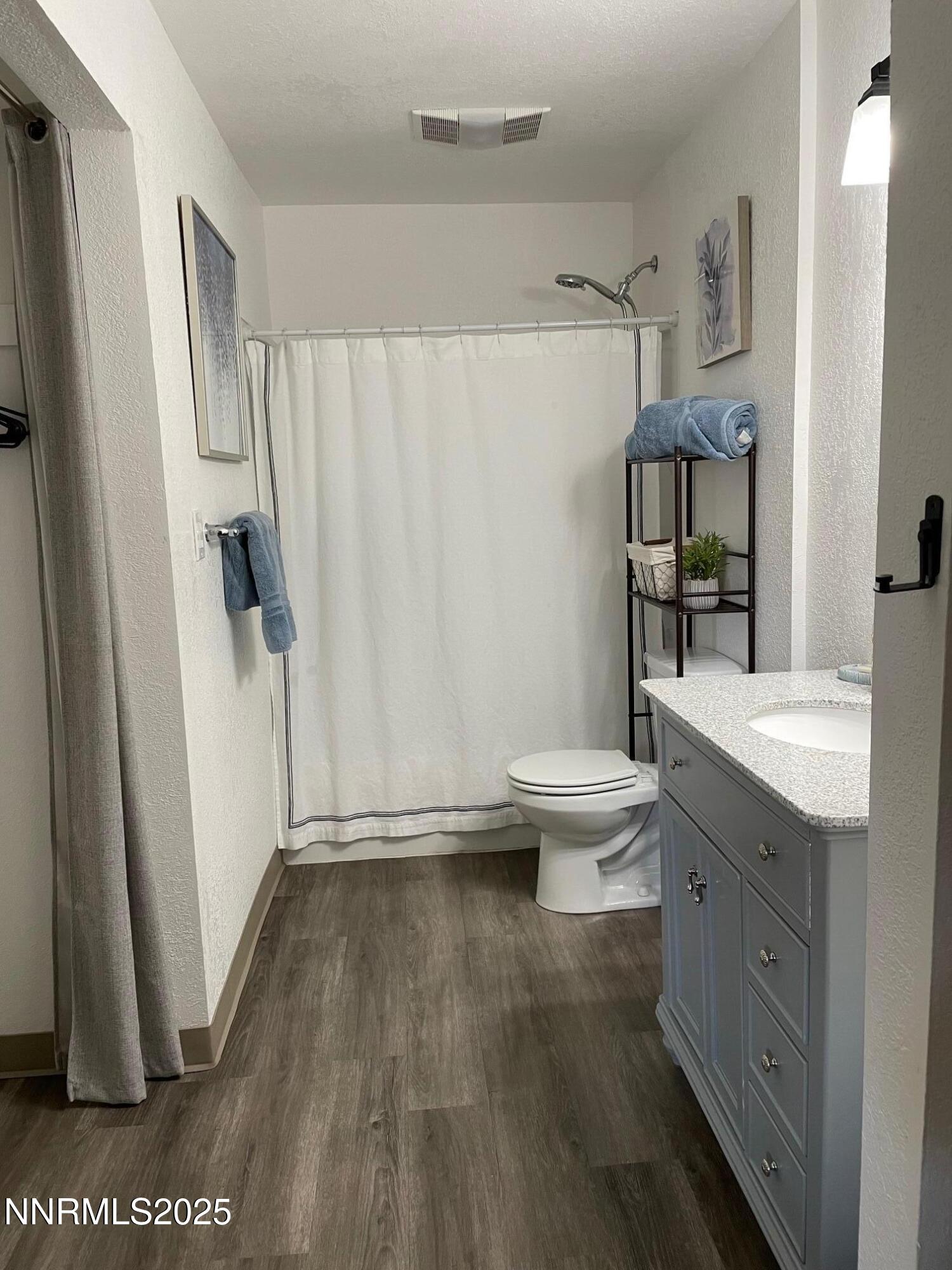 2450 Lymbery Street, Unit 230 Reno, NV 89509 - Photo 10 of 24 a bathroom with a sink a toilet and shower