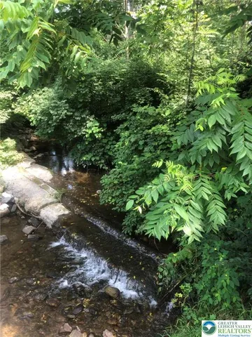 a view of swimming pool with a yard