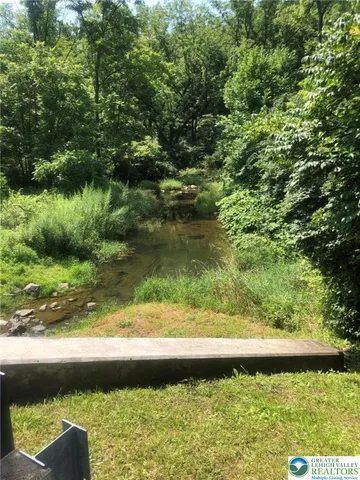 a view of swimming pool with a yard