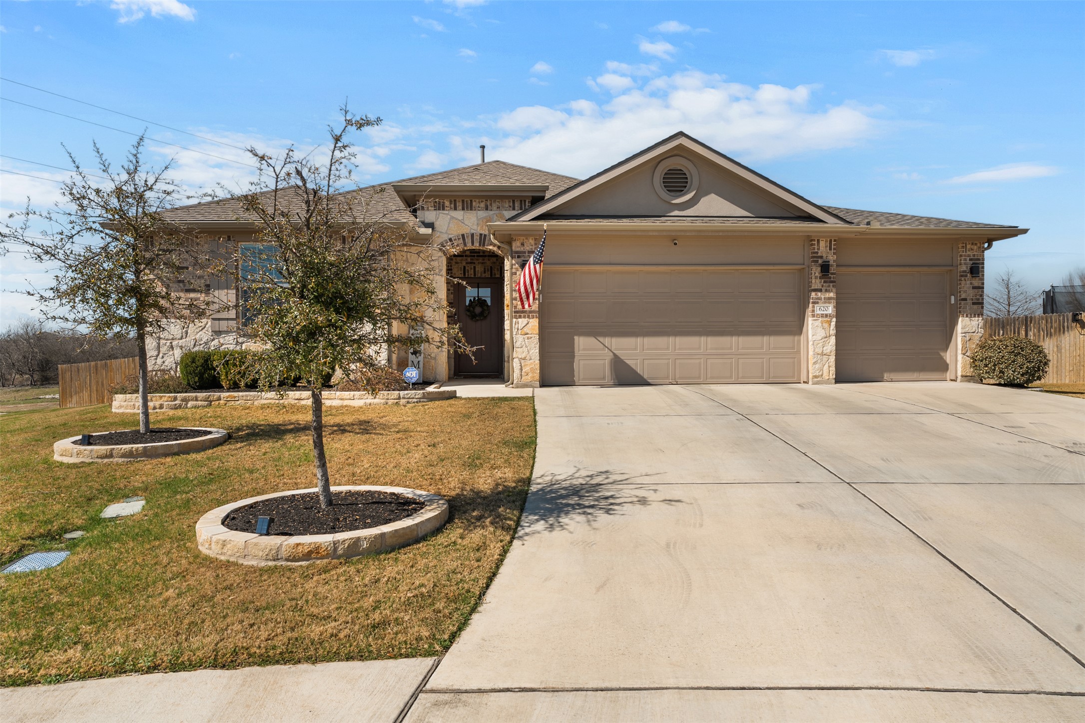 a front view of a house with a yard