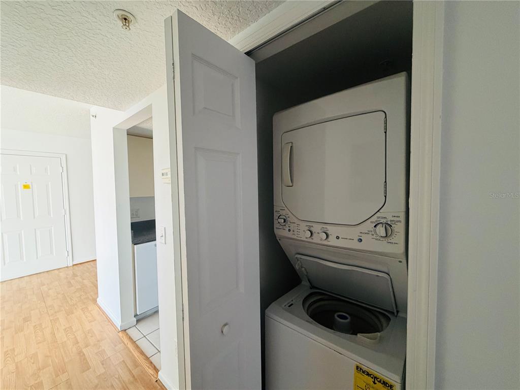 1114 South Pine Ridge Circle, Unit 14 Sanford, FL 32773 - Photo 6 of 10 a utility room with dryer and washer