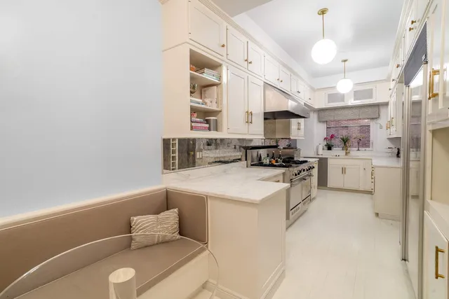 a kitchen with a sink cabinets and window