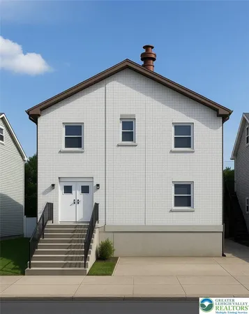 a view of a house with more windows and brick walls