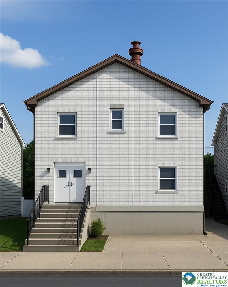 a view of a house with more windows and brick walls