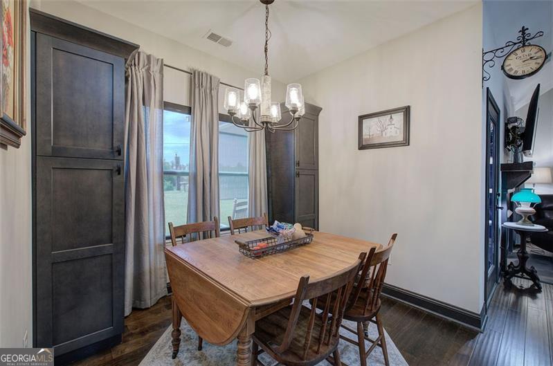 127 Alex Calhoun, GA 30701 - Photo 14 of 53 a view of a dining room with furniture and wooden floor