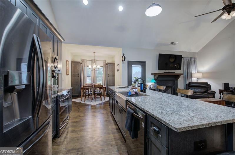 127 Alex Calhoun, GA 30701 - Photo 16 of 53 a kitchen with sink stove refrigerator and cabinets