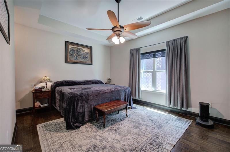 127 Alex Calhoun, GA 30701 - Photo 19 of 53 a bedroom with a bed and a chandelier