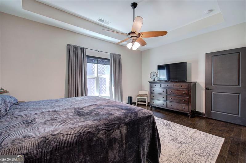 127 Alex Calhoun, GA 30701 - Photo 22 of 53 a bedroom with a bed dresser and a flat tv screen