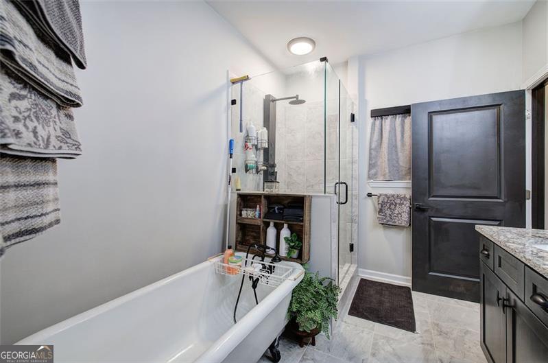 127 Alex Calhoun, GA 30701 - Photo 25 of 53 a bathroom with a tub shower vanity and a sink