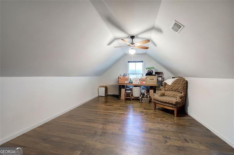 127 Alex Calhoun, GA 30701 - Photo 27 of 53 a living room with furniture and a chandelier