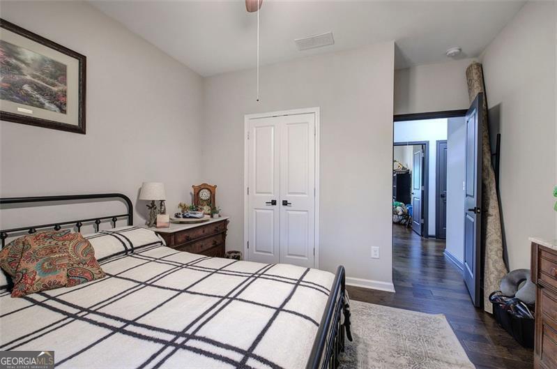 127 Alex Calhoun, GA 30701 - Photo 30 of 53 a bedroom with a bed and wooden floor