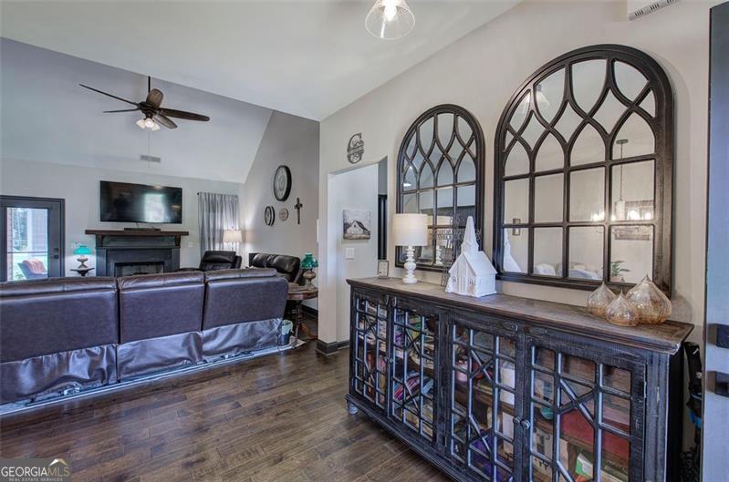 127 Alex Calhoun, GA 30701 - Photo 3 of 53 a living room with furniture a flat screen tv and a fireplace