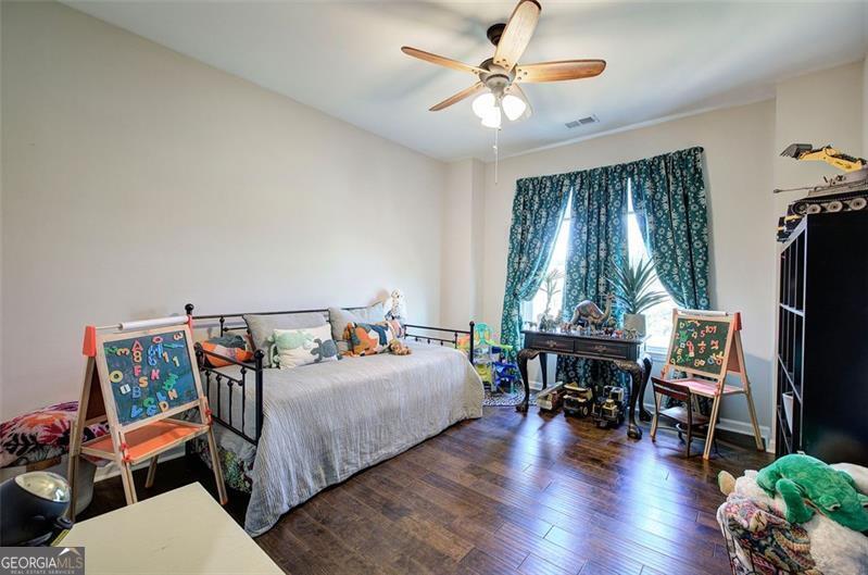 127 Alex Calhoun, GA 30701 - Photo 32 of 53 a bedroom with furniture and a chandelier