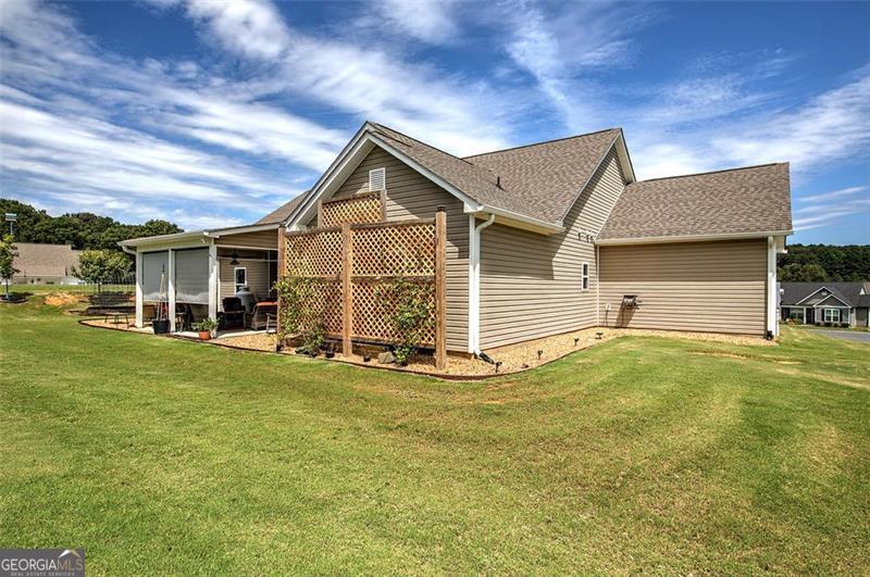 127 Alex Calhoun, GA 30701 - Photo 42 of 53 a front view of a house with a garden