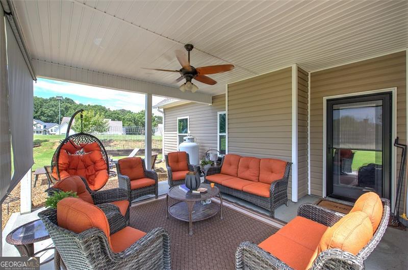 127 Alex Calhoun, GA 30701 - Photo 44 of 53 a outdoor space with patio couches and a potted plant