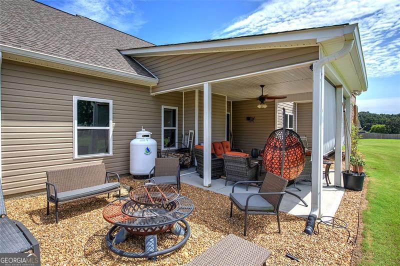 127 Alex Calhoun, GA 30701 - Photo 45 of 53 a front view of a house with patio chairs and a potted plant