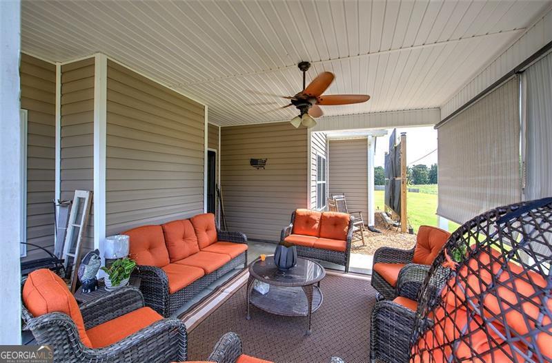 127 Alex Calhoun, GA 30701 - Photo 46 of 53 a outdoor living space with furniture and a potted plant