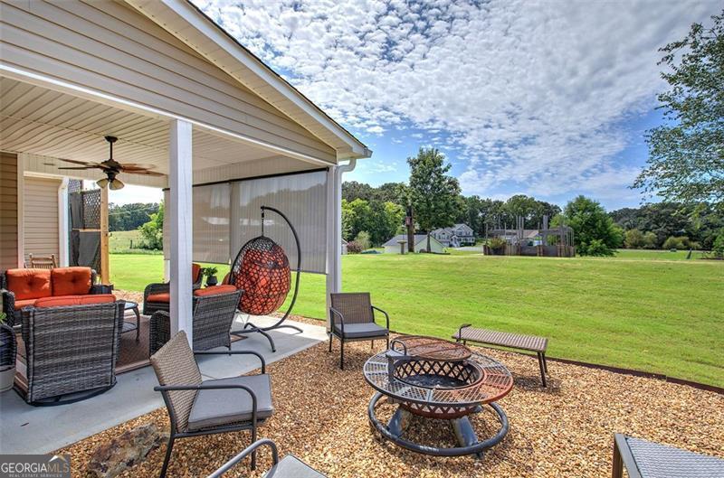 127 Alex Calhoun, GA 30701 - Photo 48 of 53 a patio with garden area and outdoor seating