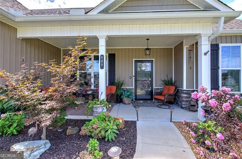 127 Alex Calhoun, GA 30701 - Photo 51 of 53 a living room filled with furniture and flowers