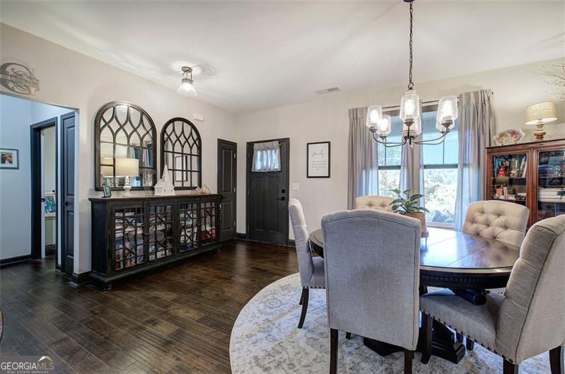 127 Alex Calhoun, GA 30701 - Photo 6 of 53 a view of a dining room with furniture window and wooden floor