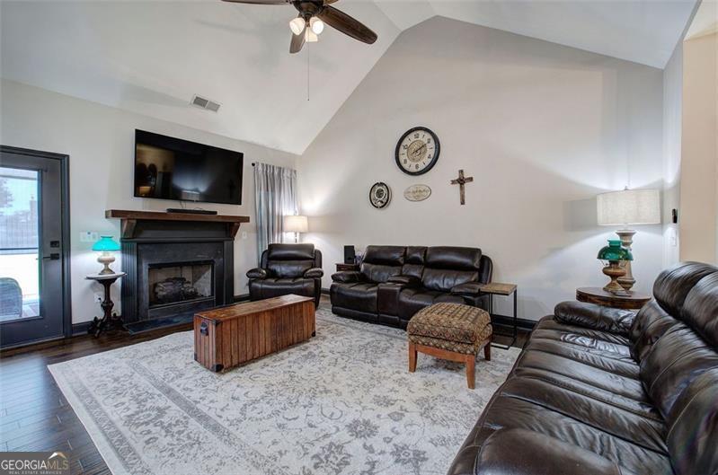 127 Alex Calhoun, GA 30701 - Photo 7 of 53 a living room with furniture a flat screen tv and a fireplace
