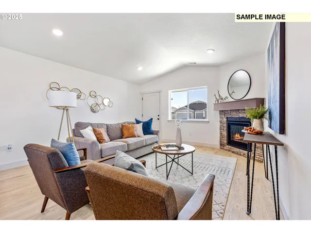 a living room with furniture a table and a fireplace