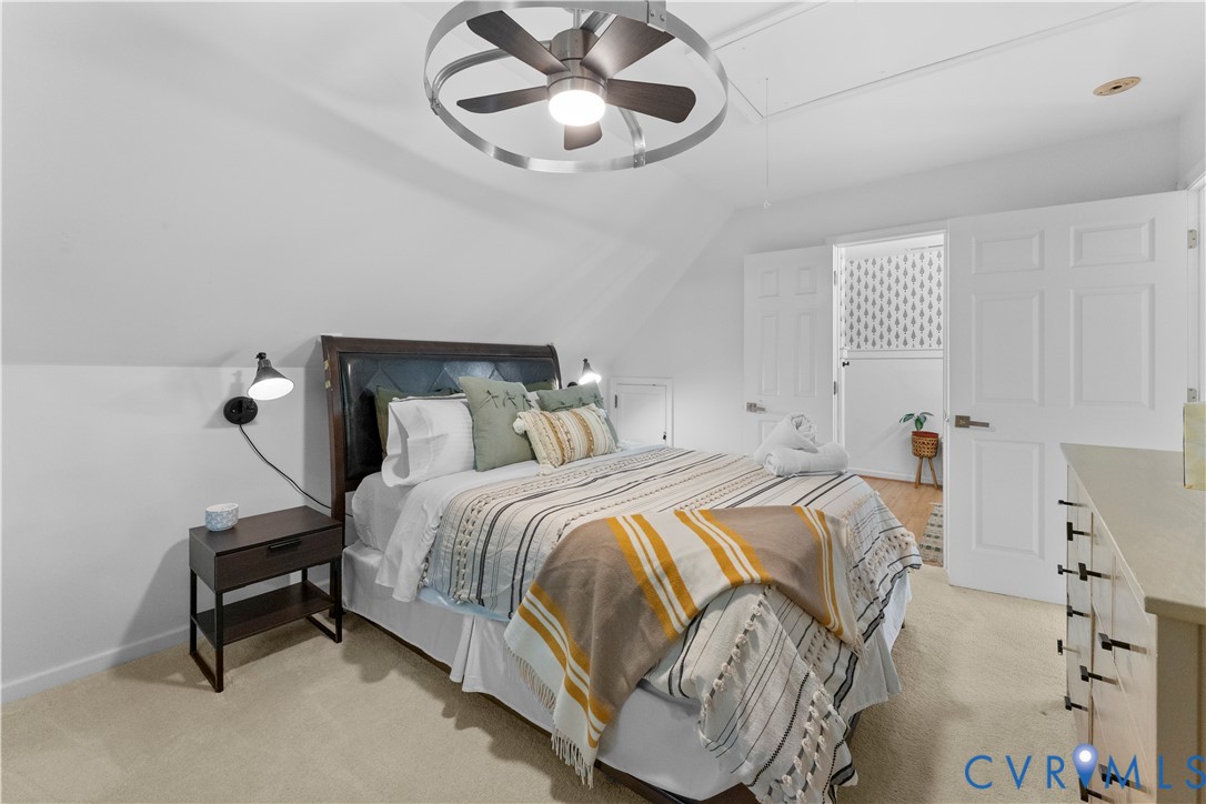 437 Plainview Road Kinsale, VA 22488 - Photo 47 of 63 a bedroom with a bed and a chandelier
