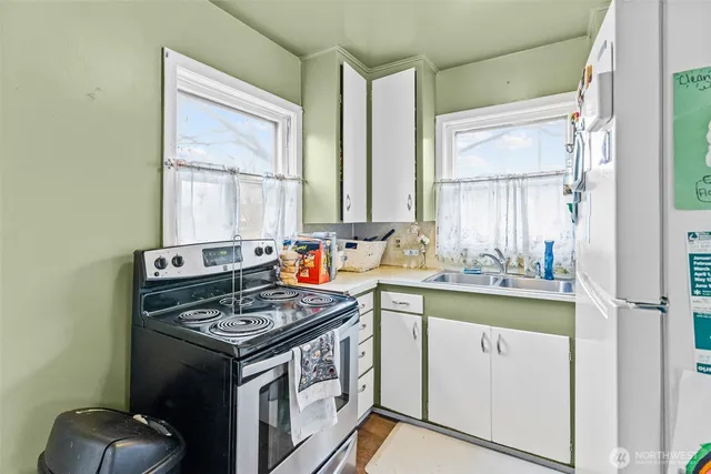 a kitchen with stainless steel appliances granite countertop a stove and a sink