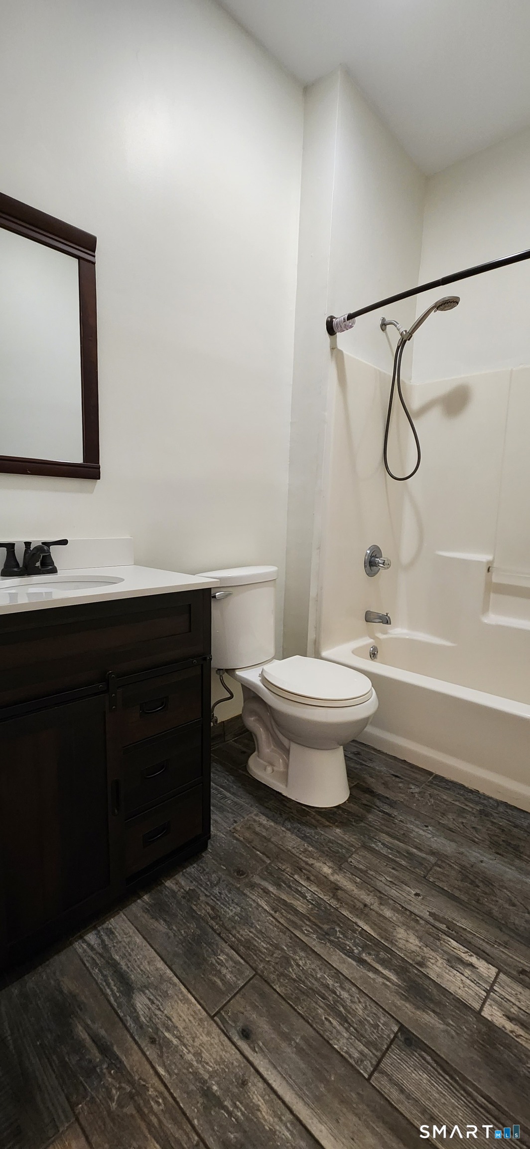 24 Meadow Street, Unit 1 Wallingford, CT 06492 - Photo 1 of 1 a bathroom with a toilet a sink and bathtub